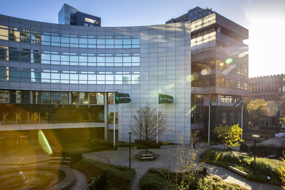 The ABN AMRO Bank main entrance on the Gustav Mahler on a sunny day with Flags. Headquarter.