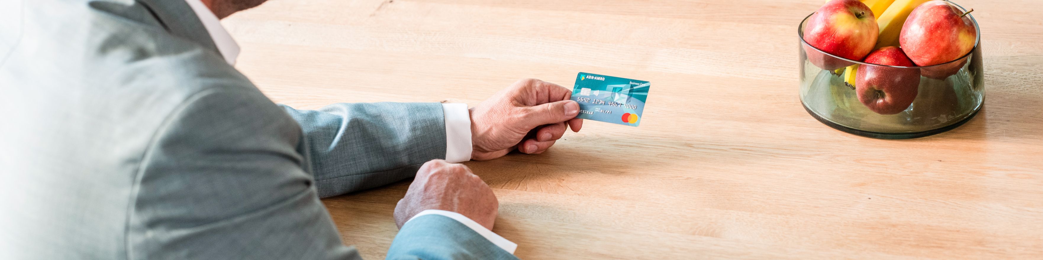 Man holding debit or credit card